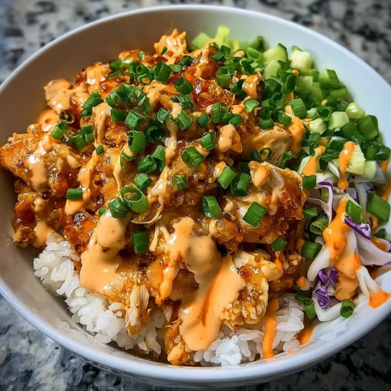 A vibrant Bang Bang Chicken Bowl topped with fresh ingredients.