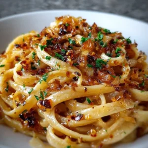 Delicious Caramelized Onion Pasta topped with chili oil for an extra kick