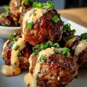 Plate of Korean BBQ meatballs served with a spicy mayo dip