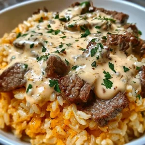 Delicious One-Pan Steak Queso Rice prepared with savory ingredients.