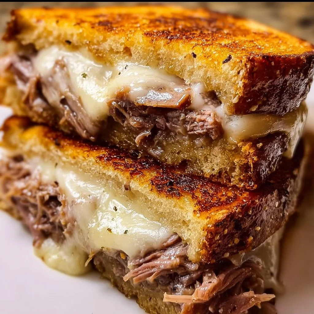 Delicious French Dip Grilled Cheese sandwich with beef and melted cheese
