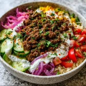 Ground beef shawarma bowl with fresh vegetables and spices