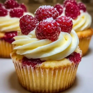 Delicious raspberry cheesecake cupcakes topped with fresh berries