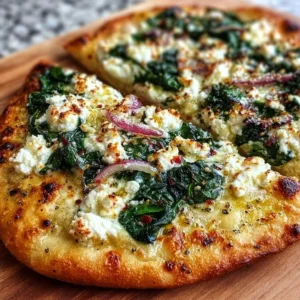 Spinach and feta flatbread pizza topped with fresh ingredients