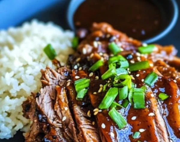 Delicious Asian Sticky BBQ Chuck Roast served with colorful vegetables
